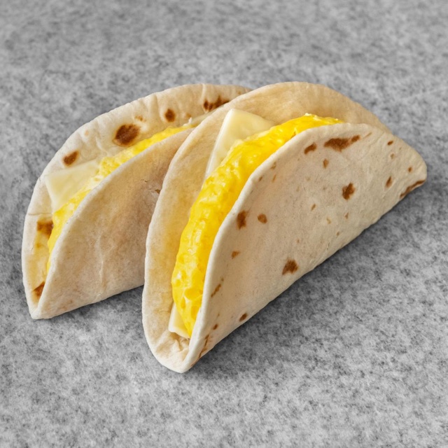 Two small egg and cheese breakfast tacos