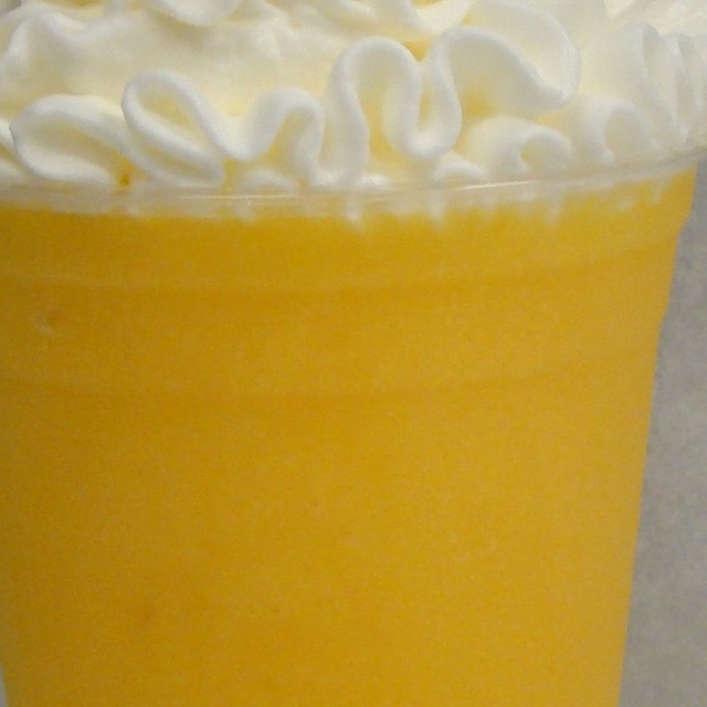 Frozen strawberry fruit chiller topped with whipped cream