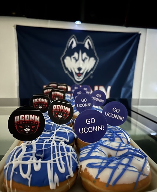 Custom UConn Huskies donuts in blue and white with Go UConn picks